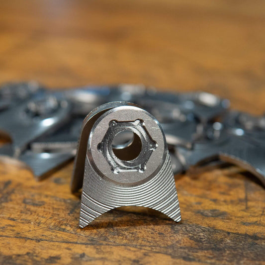 Close-up of a metal part with a hexagonal bolt.