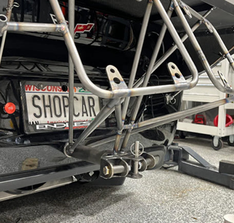 Rear view of a car frame with a license plate.