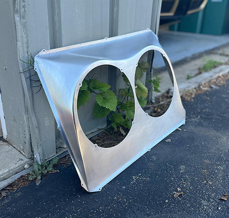 Sheet metal panel with two large circular cutouts.