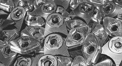 Black and white pile of metal parts.