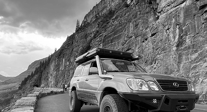 Black and white off-road vehicle near mountains